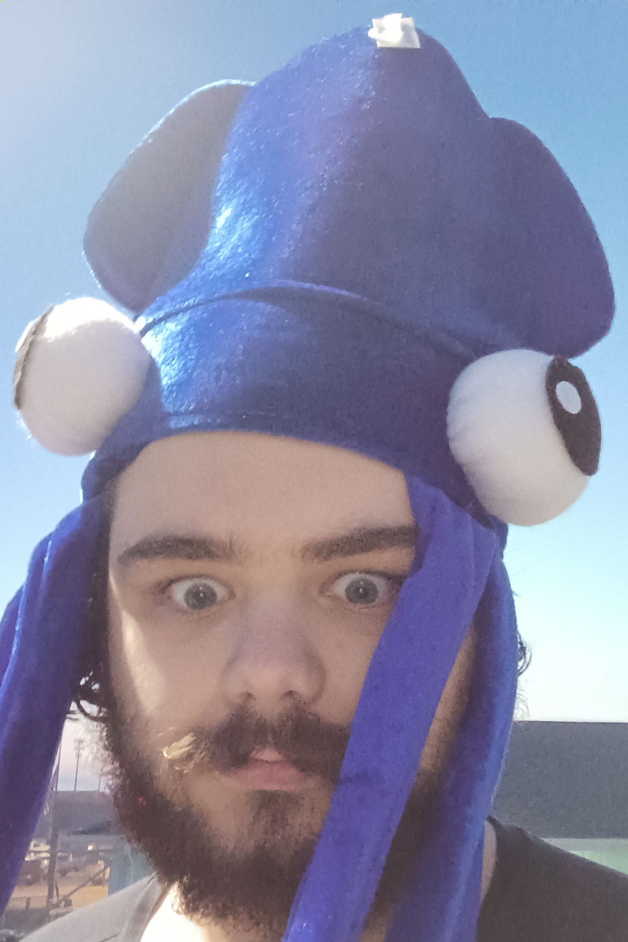 Me wearing a comical squid hat